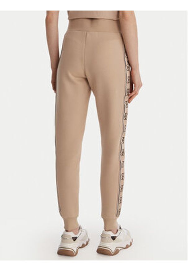 Guess Spodnie dresowe V2YB15 KB3P2 Beżowy Regular Fit. Kolor: beżowy. Materiał: syntetyk