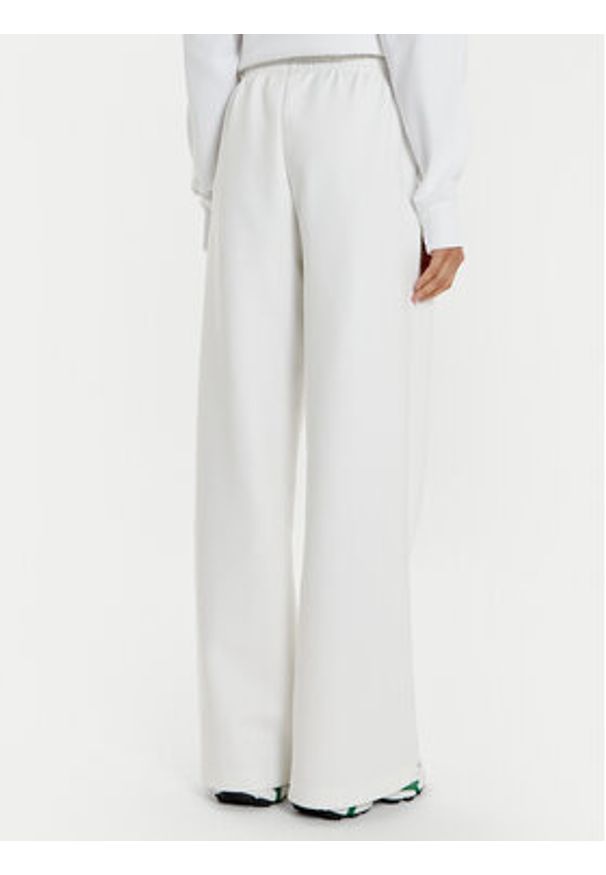 Lacoste Spodnie dresowe XF7374 Biały Wide Leg. Kolor: biały. Materiał: bawełna