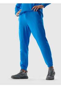 4f - Spodnie dresowe joggery z bawełną organiczną męskie - niebieskie. Kolor: niebieski. Materiał: bawełna, dresówka
