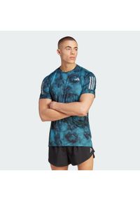 Adidas - Koszulka Own the Run Allover Print. Kolor: niebieski, wielokolorowy, czarny. Materiał: materiał. Wzór: nadruk. Sport: bieganie #1