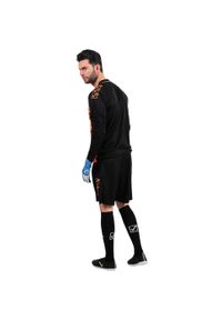 Dres piłkarski męski Givova Difesa. Kolor: czarny, pomarańczowy, wielokolorowy. Materiał: dresówka, poliester. Sport: piłka nożna