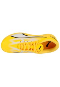 Buty piłkarskie Puma Ultra Play Tt 107533-04 żółte. Zapięcie: sznurówki. Kolor: żółty. Materiał: syntetyk, guma. Szerokość cholewki: normalna. Wzór: nadruk. Sport: piłka nożna