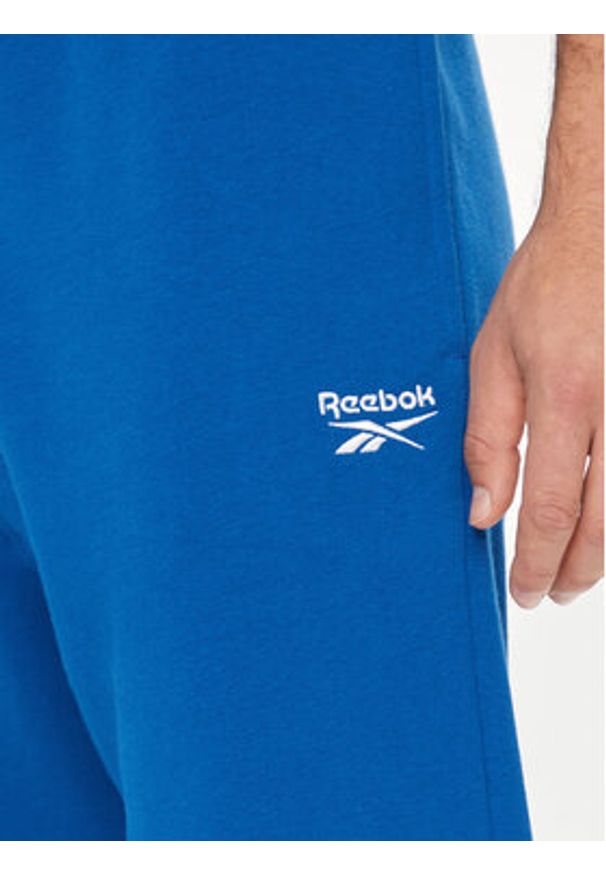 Reebok Spodnie damskie Small Logo Fleece 100202849 Niebieski Regular Fit. Kolor: niebieski. Materiał: bawełna