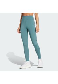 Adidas - Legginsy Own the Run 7/8. Kolor: niebieski. Materiał: materiał. Wzór: gładki. Sport: bieganie