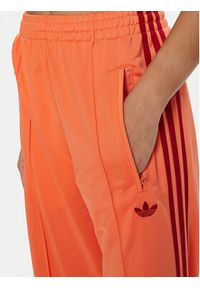 Adidas - adidas Spodnie dresowe adicolor Classic Firebird JP2309 Pomarańczowy Loose Fit. Kolor: pomarańczowy. Materiał: syntetyk #3