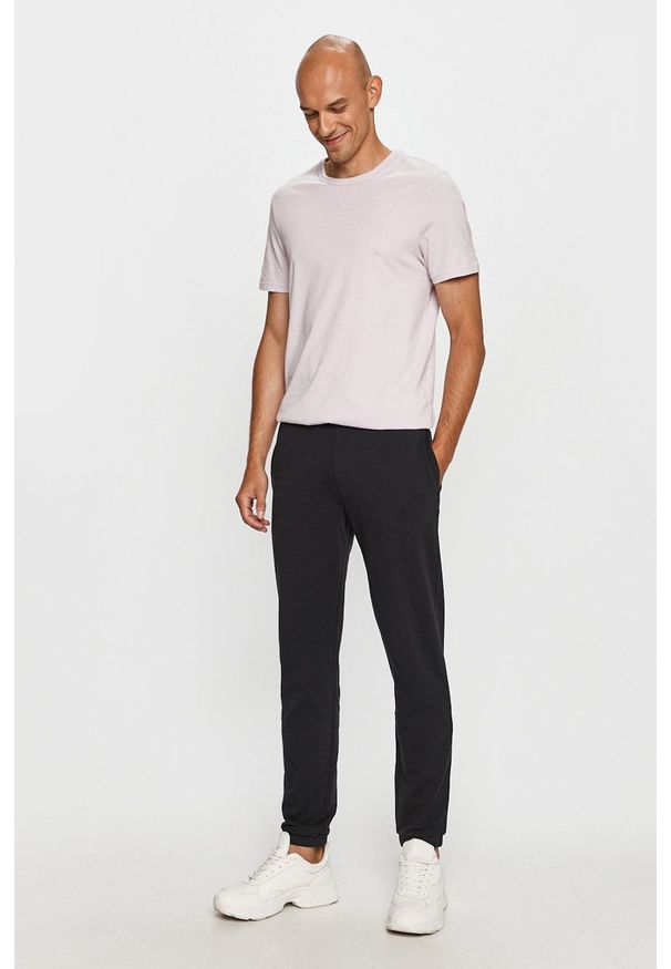 Armani Exchange - Spodnie. Kolor: niebieski