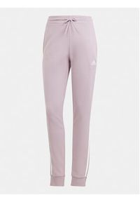 Adidas - adidas Spodnie dresowe Essentials 3-Stripes IR5379 Różowy Slim Fit. Kolor: różowy. Materiał: bawełna #4