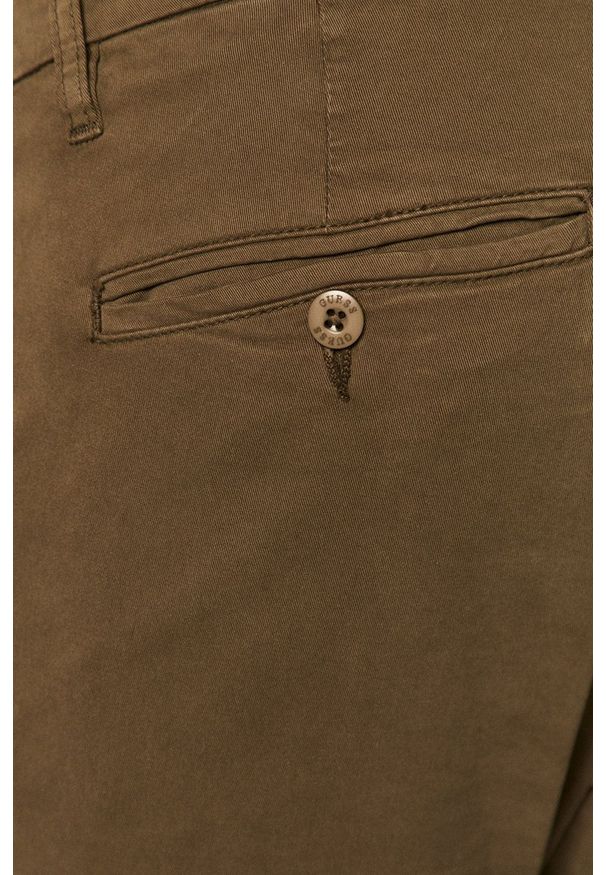 Guess - Spodnie. Kolor: zielony. Materiał: tkanina. Wzór: gładki
