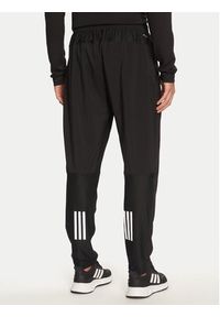 Adidas - adidas Spodnie dresowe Own The Run IK5024 Czarny Regular Fit. Kolor: czarny. Materiał: syntetyk. Sport: bieganie #2