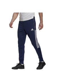 Adidas - Spodnie męskie adidas Tiro 21 Track Pants. Kolor: wielokolorowy, biały, niebieski