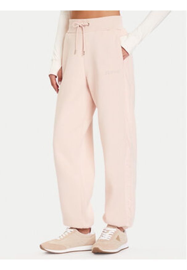 Guess Spodnie dresowe V5BB10 KB681 Różowy Regular Fit. Kolor: różowy. Materiał: syntetyk
