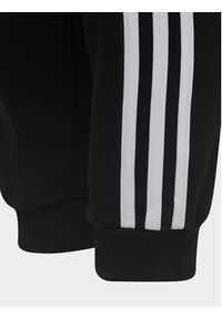 Adidas - adidas Spodnie dresowe adidas Essential 3-Stripes Joggers H65796 Czarny Regular Fit. Kolor: czarny. Materiał: bawełna #5