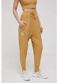 Eivy spodnie damskie kolor żółty gładkie. Kolor: żółty. Materiał: dzianina, poliester. Wzór: gładki