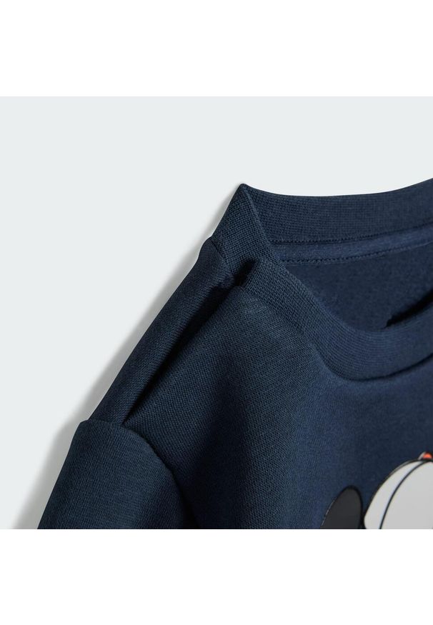 Adidas - Zestaw Disney Mickey Mouse Jogger Kids. Kolor: żółty, pomarańczowy, wielokolorowy, fioletowy. Wzór: motyw z bajki. Styl: młodzieżowy