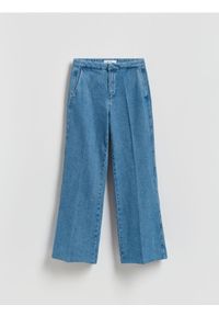 Reserved - Jeansy flare z kantem - niebieski. Kolor: niebieski
