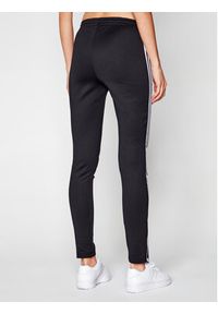 Adidas - adidas Spodnie dresowe Sst GD2361 Czarny Slim Fit. Kolor: czarny. Materiał: dresówka, bawełna, syntetyk