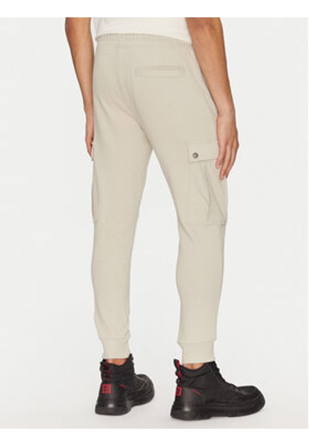 BOSS Spodnie dresowe Seteam 50542917 Beżowy Regular Fit. Kolor: beżowy. Materiał: bawełna