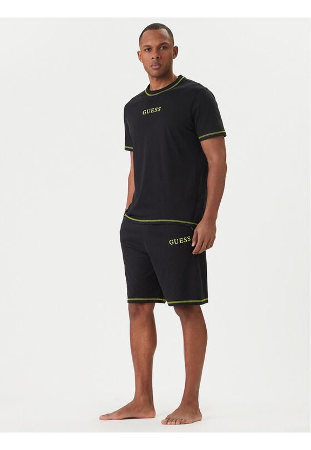 Guess Piżama U6GX03 KCAM1 Czarny Regular Fit. Kolor: czarny. Materiał: bawełna