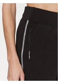 Calvin Klein Performance Spodnie dresowe 00GWF3P636 Czarny Relaxed Fit. Kolor: czarny. Materiał: syntetyk, dresówka