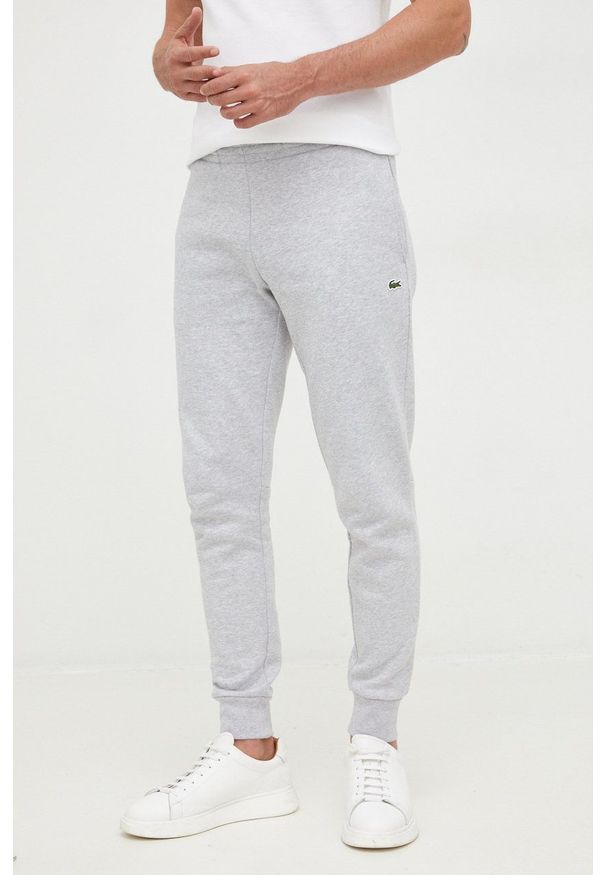 Lacoste spodnie dresowe męskie kolor szary gładkie XH9624-132. Kolor: szary. Materiał: dresówka. Wzór: gładki