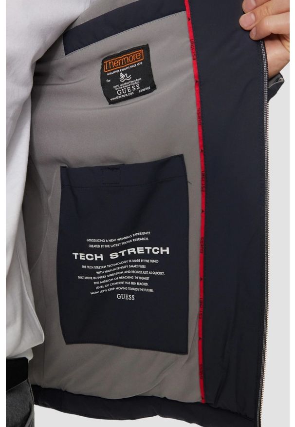 Guess - GUESS Granatowa męska kurtka Biker Jacket, Rozmiar M. Typ kołnierza: bez kaptura. Kolor: niebieski. Materiał: poliamid, syntetyk. Długość rękawa: długi rękaw. Długość: długie. Styl: wizytowy