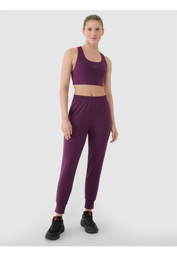 4f - 4F Spodnie treningowe szybkoschnące damskie - fioletowe S. Kolor: fioletowy. Materiał: elastan, materiał, włókno, dzianina, syntetyk. Wzór: jednolity, ze splotem. Sport: fitness