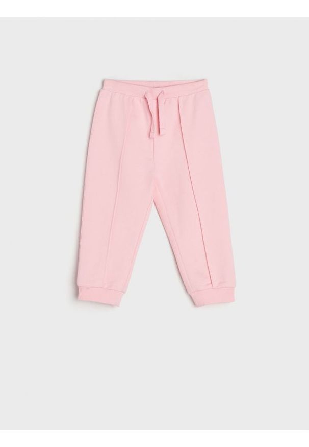 Sinsay - Spodnie dresowe jogger - begonia. Materiał: dresówka