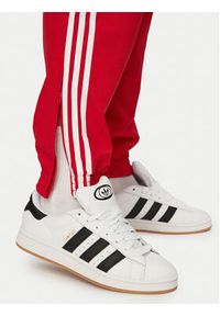 Adidas - adidas Spodnie dresowe Firebird Woven KE1369 Czerwony Regular Fit. Kolor: czerwony. Materiał: syntetyk #3