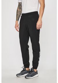 Adidas - adidas - Spodnie. Kolor: czarny. Materiał: tkanina, poliester, materiał. Wzór: gładki #2