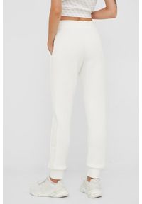 Guess - GUESS Beżowe spodnie dresowe damskie Allie Scuba, Rozmiar L. Kolor: beżowy. Materiał: dresówka #4