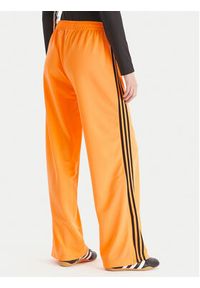 Adidas - adidas Spodnie dresowe adicolor Classic Firebird JY2694 Żółty Loose Fit. Kolor: żółty. Materiał: syntetyk