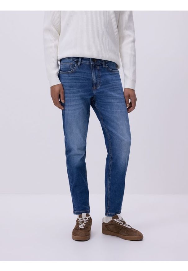 Reserved - Jeansy skinny z efektem sprania - niebieski. Kolor: niebieski