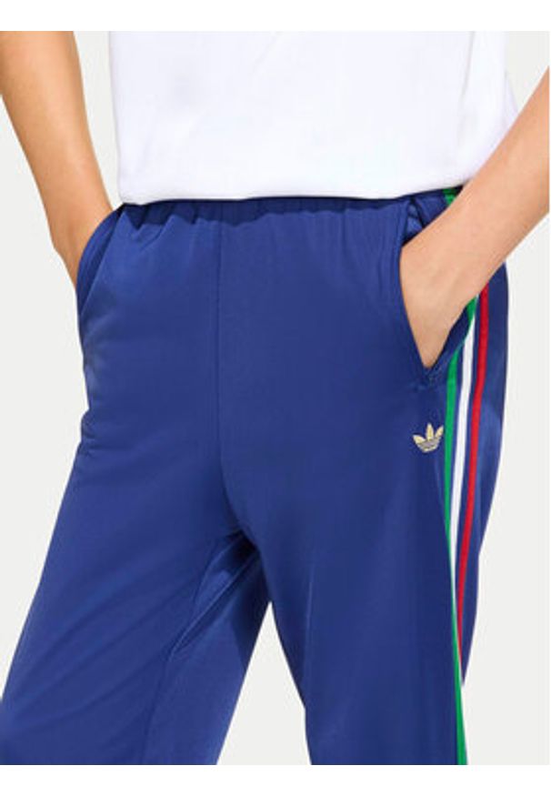 Adidas - adidas Spodnie dresowe Firebird KC9503 Niebieski Regular Fit. Kolor: niebieski. Materiał: syntetyk