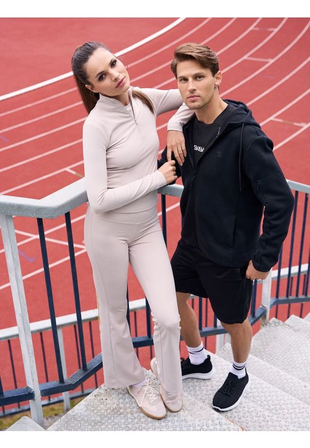Sinsay - Spodnie flare Gym Hard - kremowy. Kolor: kremowy