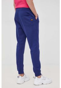 G-Star RAW - G-Star Raw spodnie męskie gładkie. Kolor: niebieski. Materiał: poliester. Wzór: gładki