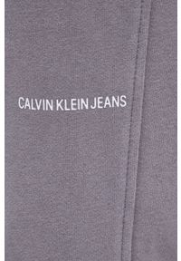 Calvin Klein Jeans Spodnie bawełniane męskie kolor szary gładkie. Kolor: szary. Materiał: bawełna. Wzór: gładki