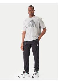 Adidas - adidas Spodnie dresowe Training Essentials Holiday JM5441 Czarny Regular Fit. Kolor: czarny. Materiał: syntetyk #3