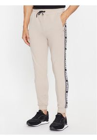 Guess Spodnie dresowe Z2YB19 K6ZS1 Beżowy Regular Fit. Kolor: beżowy. Materiał: bawełna #1