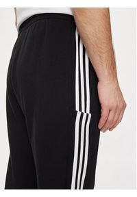 Adidas - adidas Spodnie dresowe Essentials French Terry Tapered Cuff 3-Stripes Joggers HA4337 Czarny Regular Fit. Kolor: czarny. Materiał: bawełna #2