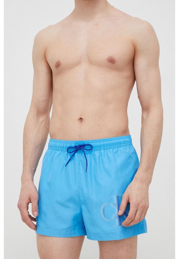 Calvin Klein szorty kąpielowe kolor niebieski. Kolor: niebieski. Materiał: tkanina, poliester, materiał. Wzór: nadruk