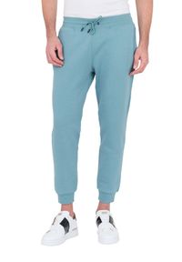 Guess - GUESS Turkusowe spodnie dresowe Aldwin. Kolor: niebieski. Materiał: dresówka #3
