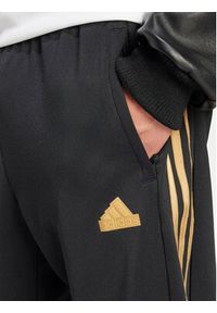 Adidas - adidas Spodnie dresowe House of Tiro Nations IW8865 Czarny Regular Fit. Kolor: czarny. Materiał: bawełna
