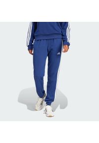 Adidas - Spodnie Essentials 3-Stripes French Terry Cuffed. Kolor: biały, wielokolorowy, niebieski. Materiał: materiał