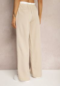 Renee - Jasnobeżowe Materiałowe Spodnie z Szerokimi Nogawkami High Waist z Gumką w Talii Comina. Okazja: na co dzień. Stan: podwyższony. Kolor: beżowy. Materiał: materiał. Styl: casual, elegancki