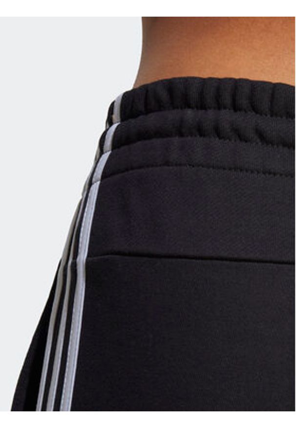 Adidas - adidas Spodnie dresowe Essentials 3-Stripes French Terry Cuffed Joggers IC8770 Czarny Slim Fit. Kolor: czarny. Materiał: bawełna