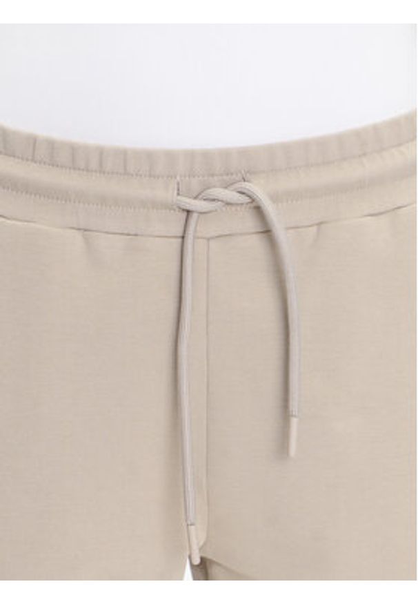 EA7 Emporio Armani Spodnie dresowe 7W000489 AF12951 U6155 Beżowy Regular Fit. Kolor: beżowy. Materiał: bawełna