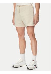 Tommy Jeans Szorty sportowe DM0DM21931 Beżowy jasny Regular Fit. Kolor: beżowy. Materiał: bawełna. Styl: sportowy #1