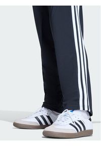 Adidas - adidas Spodnie dresowe Firebird Track KE0910 Czarny Regular Fit. Kolor: czarny. Materiał: syntetyk #2
