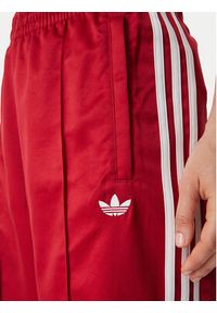 Adidas - adidas Spodnie dresowe Satin Sst Loose Trackpant KS7338 Czerwony Relaxed Fit. Kolor: czerwony. Materiał: syntetyk #4
