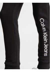 Calvin Klein Jeans Spodnie dresowe Logo IU0IU00604 Czarny Regular Fit. Kolor: czarny. Materiał: bawełna